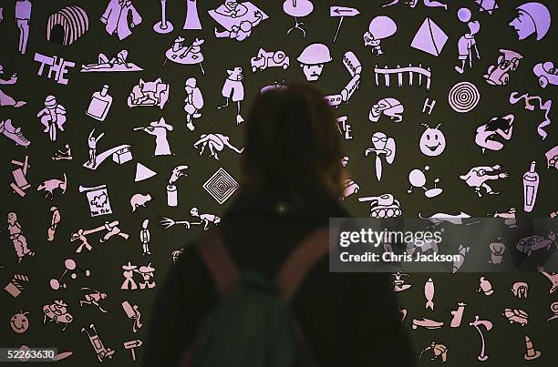 Woman looks at an art installation by Jonathon Huxley called 'Boys Own Stories' as part of a collection of work from 60 finalists entered in the...