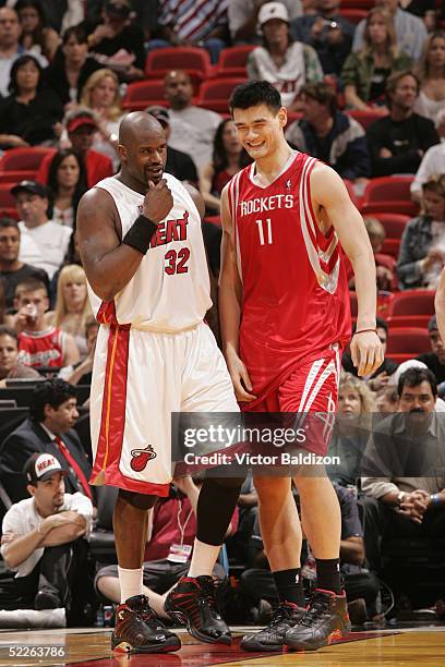 Shaquille O'Neal of the Miami Heat laughs with Yao Ming of the Houston Rockets during the game at American Airlines Arena on January 30, 2005 in...