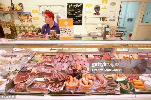 Shop employee tends the meat selction at a store of German organic supermarket chain EO Komma March 2, 2005 in Berlin, Germany. According to the...