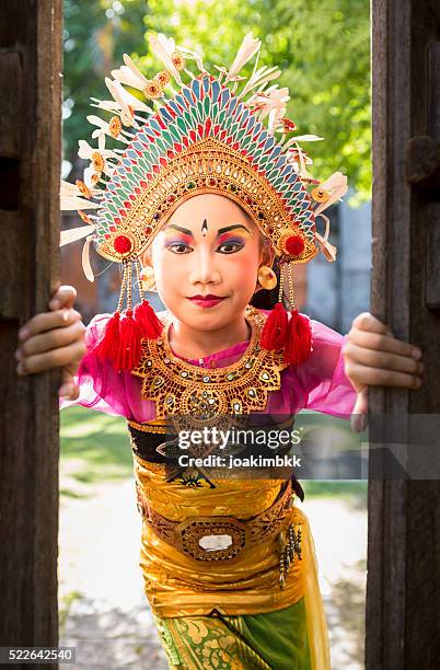 young girl with traditional costume in a bali temple - bali temples stock pictures, royalty-free photos & images