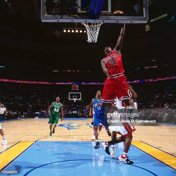 Luol Deng of the Rookie Team shoots against Dwyane Wade of the Sophomore Team during the 2005 Got Milk? Rookie Challenge on February 18, 2005 at The...