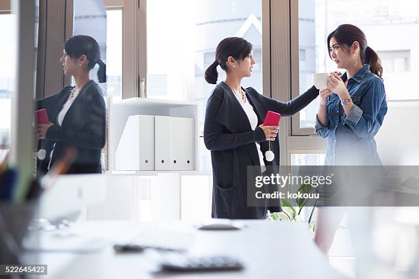 women who have been comforted to colleagues to break time - showing compassion stock pictures, royalty-free photos & images