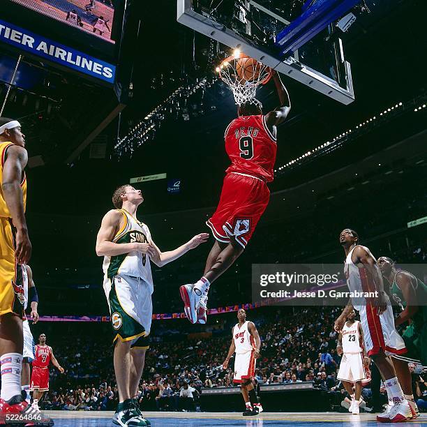 Luol Deng of the Rookie Team dunks against Luke Ridnour of the Sophomore Team during the 2005 Got Milk? Rookie Challenge on February 18, 2005 at The...