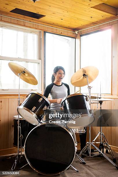rocking out on the drums - playing drums stockfoto's en -beelden
