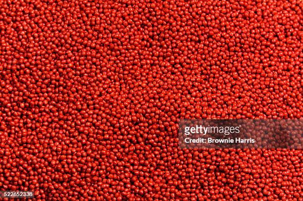red plastic pellets - granule stockfoto's en -beelden