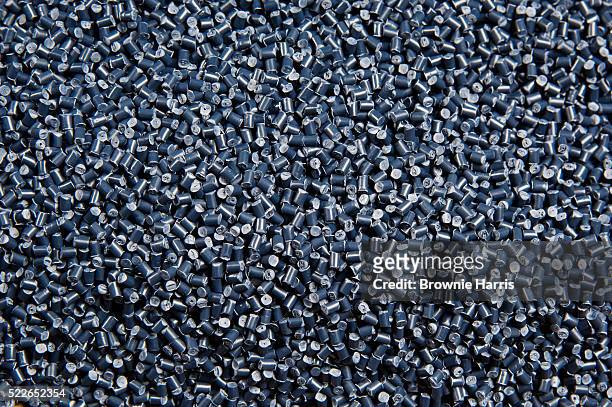 gray plastic pellets - granule stockfoto's en -beelden