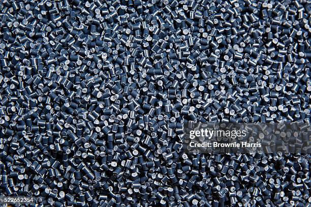 gray plastic pellets - granule stock pictures, royalty-free photos & images