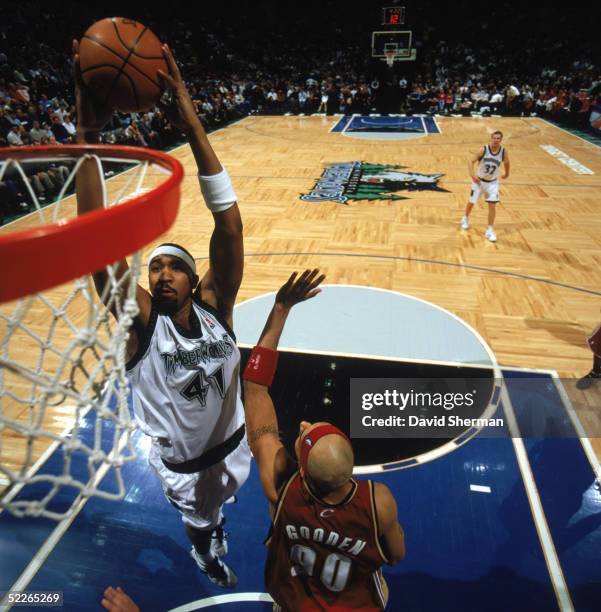 Eddie Griffin of the Minnesota Timberwolves takes the ball to the basket over Drew Gooden of the Cleveland Cavaliers during a game at Target Center...