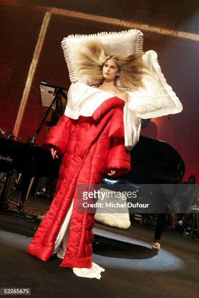 Model walks down the runway at the Viktor & Rolf fashion show as part of Paris Fashion Week Ready To Wear Autumm/Winter 2006 on March 2, 2005 in...