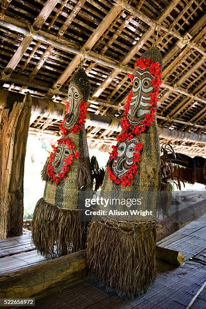 tumbuan or female masks in the palimbei village spirit house - tumbuan photos et images de collection