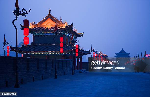 xian old city wall at dusk - xi'an stock pictures, royalty-free photos & images