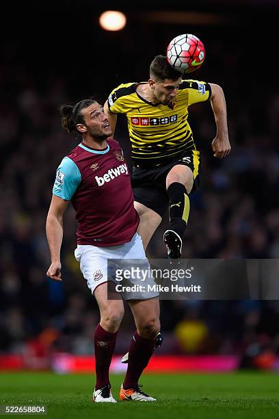 Craig Cathcart of Watford wins a header over Andy Carroll of West Ham United during the Barclays Premier League match between West Ham United and...