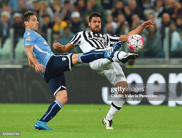 Sami Khedira of Juventus FC is challenged by Lucas Biglia of SS Lazio during the Serie A match between Juventus FC and SS Lazio at Juventus Arena on...