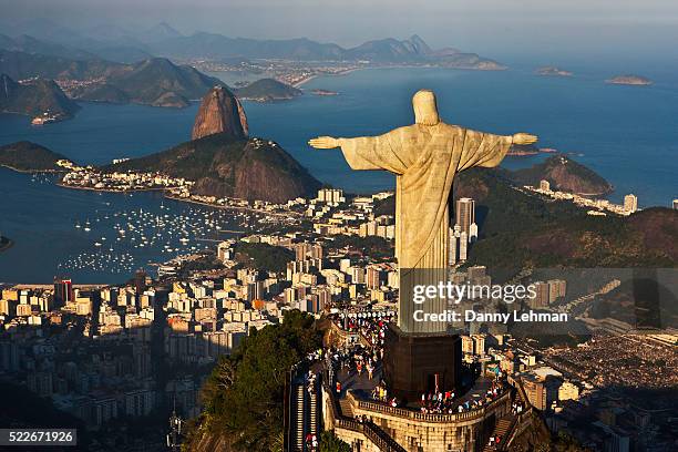 christ the redeemer overlooking rio de janeiro - christ the redeemer rio stock pictures, royalty-free photos & images