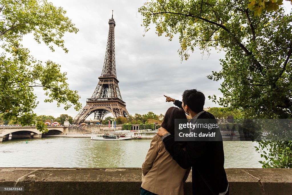 Sightseeing Young Asian couple on romantic vacation in Paris