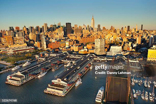 chelsea piers golf club with midtown manhattan skyline, new york - chelsea piers photos stock pictures, royalty-free photos & images