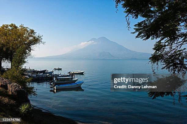 lake atitlan and volcanoes seen from panajachel - panajachel stock pictures, royalty-free photos & images