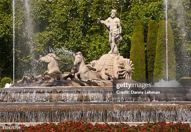 neptune statue and fountain near the prado museum in madrid - neptune roman god stock pictures, royalty-free photos & images