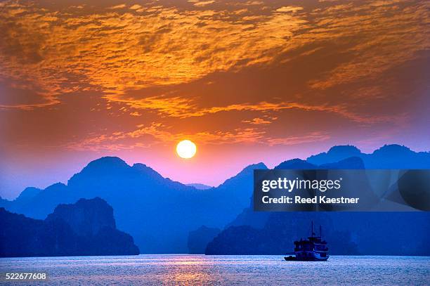 halong bay at sunset - halong bay stock pictures, royalty-free photos & images