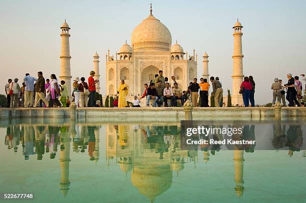 tourists at reflecting pool in front of taj mahal - uttar pradesh assembly stock pictures, royalty-free photos & images