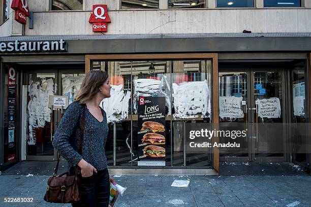 Painted window of a fast food restaurant is seen as the 'Nuit Debout' movement protest against the new labour law, commonly referred as the 'El...