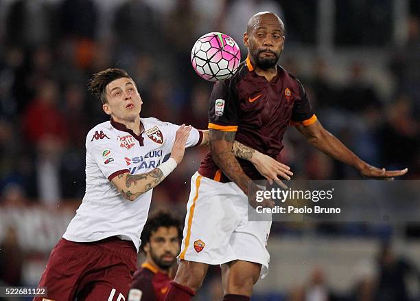 Daniele Baselli of Torino FC competes for the ball with Maicon AS Roma during the Serie A match between AS Roma and Torino FC at Stadio Olimpico on...