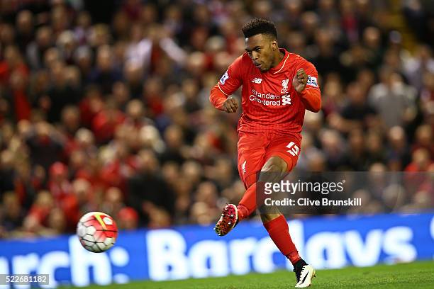 Daniel Sturridge of Liverpool scores his sides third goal during the Barclays Premier League match between Liverpool and Everton at Anfield, April 20...