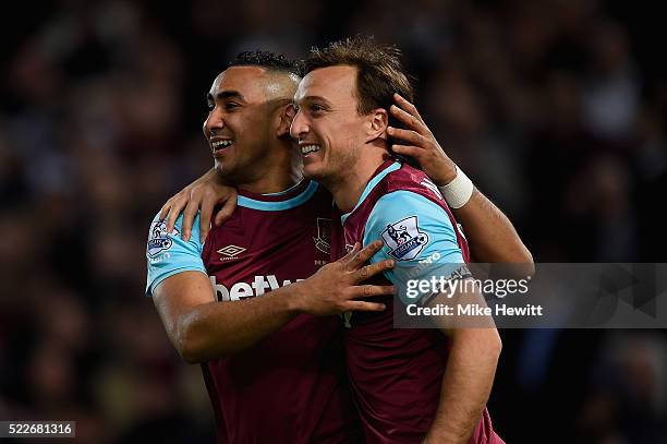 Mark Noble of West Ham United celebrates with Dimitri Payet of West Ham United scoring his second goal during the Barclays Premier League match...