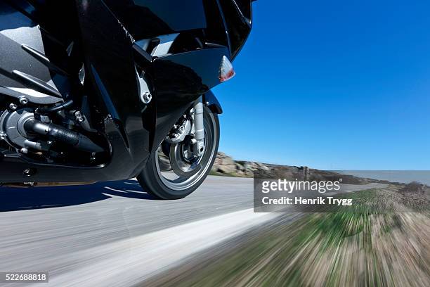 motorcycle on road - image stockfoto's en -beelden
