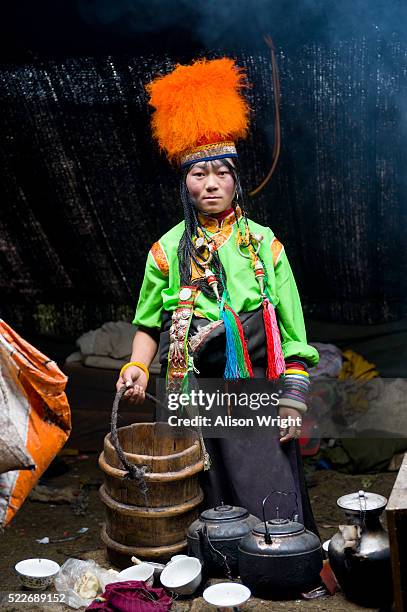 tibetan nomad girl in degang valley - orange bucket hat stock pictures, royalty-free photos & images