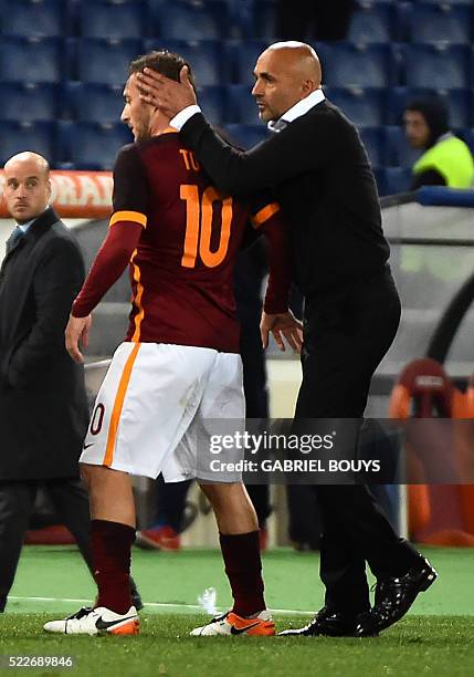 Roma's forward from Italy Francesco Totti is congratulated by Roma's coach from Italy Luciano Spalletti during the Italian Serie A football match...