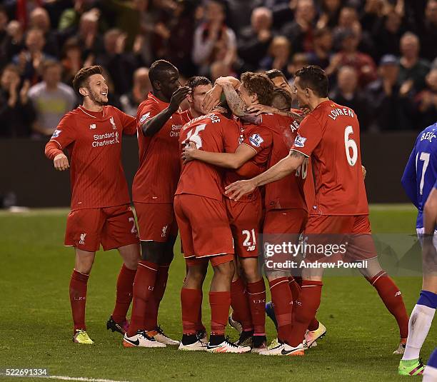 Daniel Sturridge of Liverpool is congratulated after his goal during the Barclays Premier League match between Liverpool and Everton at Anfield on...