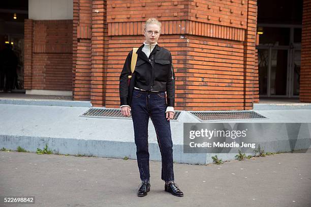 Danish model Frederikke Sofie wears large-frame glasses, a J.W. Anderon top, carries a Celine twisted cabas bag, and wears handwoven Faustine...