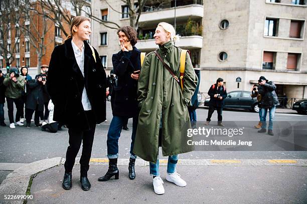 Models Laura Kampman, Marte Mei Van Haaster, and Maggie Maurer carry Celine twisted cabas bags after the Celine show at Tennis Club de Paris on Day 6...