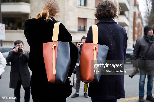 Dutch models Laura Kampman and Marte Mei Van Haaster carry Celine twisted cabas bags after the Celine show at Tennis Club de Paris on Day 6 of PFW...