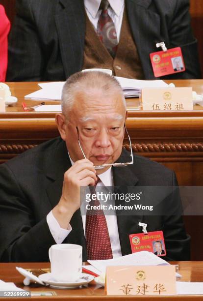 Hong Kong's Chief Executive Tung Chee-Hwa attends the opening ceremony of the CPPCC at the Great Hall of the People on March 3, 2005 in Beijing,...