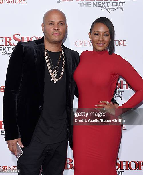 Producer Stephen Belafonte and actress/singer Melanie Brown arrive at the premiere of New Line Cinema's 'Barbershop: The Next Cut' at TCL Chinese...