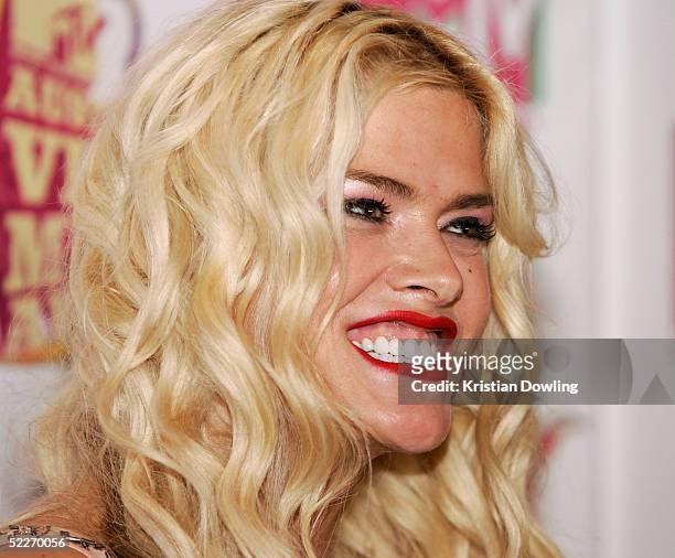 Personality Anna Nicole Smith poses in the media room at the inaugural MTV Australia Video Music Awards at Luna Park on March 3, 2005 in Sydney,...