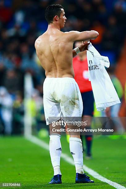 Cristiano Ronaldo of Real Madrid CF takes off his t-shirt during the La Liga match between Real Madrid CF and Villarreal CF at Estadio Santiago...