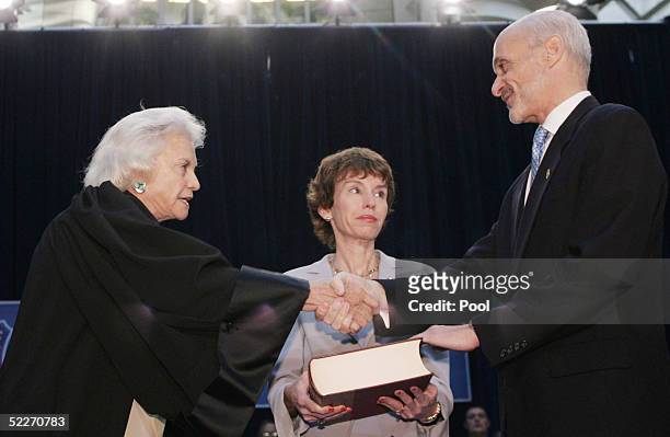 Supreme Court Justice Sandra Day O'Connor shakes hands with Secretary of Homeland Security Michael Chertoff after he takes the oath of office as...