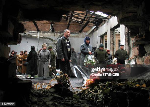Around 200 friends and relatives of victims killed in the Beslan school hostage massacre gather 03 March 2005 in the remains of the school in Beslan...