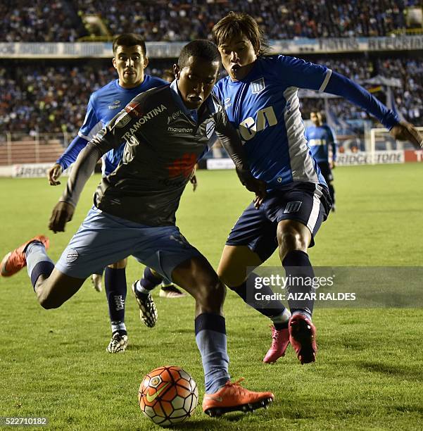 Jaime Arascaita of Bolivia's Bolivar, vies for the ball with Oscar Romero , of Argentina's Racing Club, during their 2016 Copa Libertadores football...