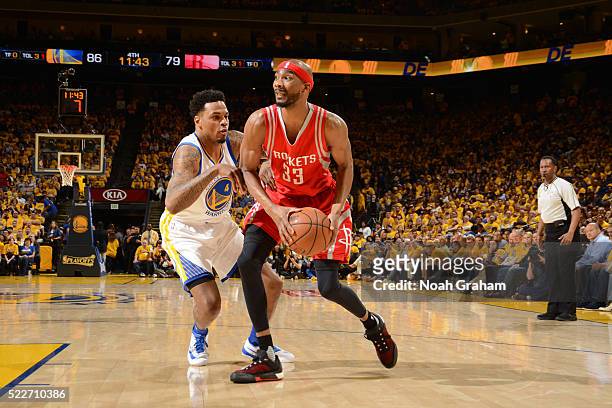 Corey Brewer of the Houston Rockets drives to the basket during the game against Brandon Rush of the Golden State Warriors in Game Two of the Western...