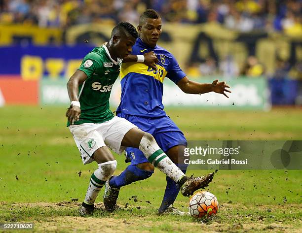Frank Fabra of Boca Juniors fights for the ball with Mateo Casierra of Deportivo Cali during a match between Boca Juniors and Deportivo Cali as part...