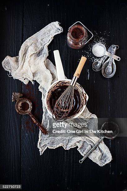 melted chocolate and cocoa with whisk and spoons - powdered sugar sifter fotografías e imágenes de stock