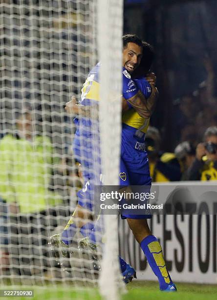 Andres Chavez of Boca Juniors celebrates with Cristian Pavón after scoring the third goal of his team during a match between Boca Juniors and...