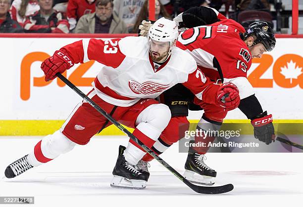 Brian Lashoff of the Detroit Red Wings plays against Zack Smith of the Ottawa Senators at Canadian Tire Centre on November 4, 2014 in Ottawa,...