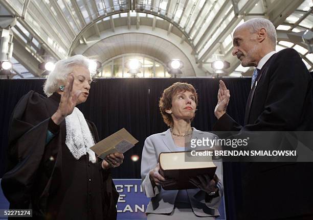 Michael Chertoff is sworn in by Supreme Court Justice Sandra Day O'Connor while his wife Meryl looks on during the swearing-in ceremony for the...