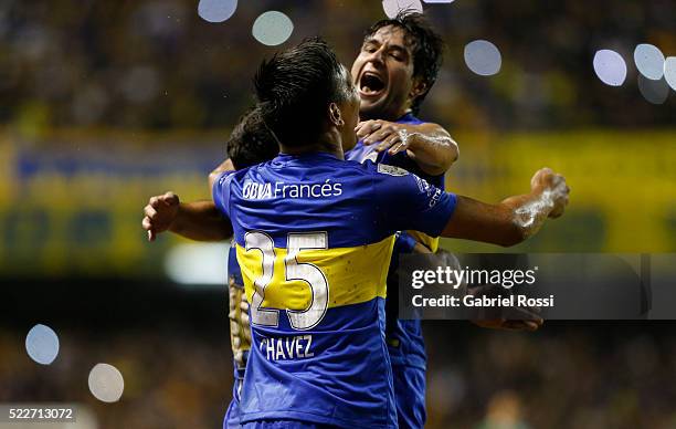 Carlos Tevez of Boca Juniors celebrates with teammates after scoring the fourth goal of his team during a match between Boca Juniors and Deportivo...