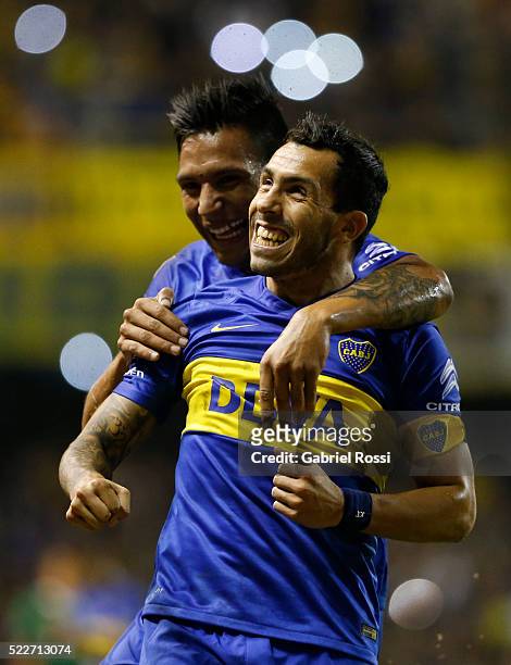 Carlos Tevez of Boca Juniors celebrates with Andres Chavez after scoring the fourth goal of his team during a match between Boca Juniors and...